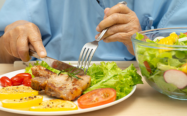Healthy meal after gallbladder surgery with grilled fish, fresh salad and low fat diet