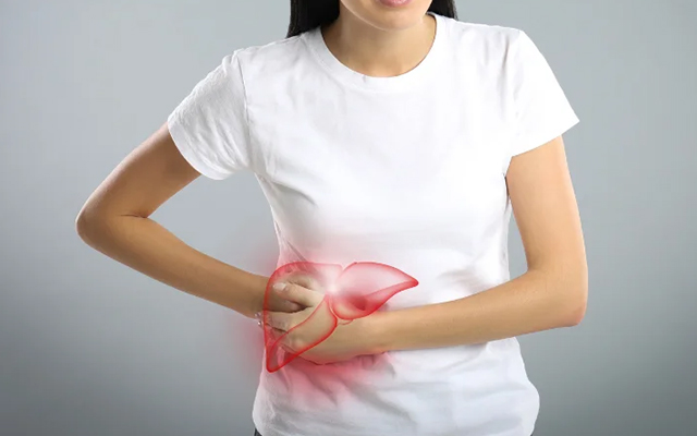 Woman holding her abdomen with highlighted area showing liver pain, symbolizing liver issues
